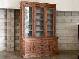 It has a tin lined base drawer, a tin bin on the top door, and a tin backed top compartment with a top shoot entry. Large School Library Bookcase In Sold Vitrine