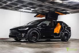 Gorgeous, all blacked out tesla model x. Orange And The All Black Meet T Sportline S Widebody Tesla Model X Carscoops Tesla Model X Tesla Model Custom Lamborghini