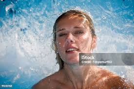 Happy Man Relaxing In The Hot Tub And Closing His Eyes Caucasian Boy  Resting In A Pool Lies In Water View From Above Swimming Guy In A Pool With  Blue Water Bathing