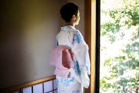 Check spelling or type a new query. Rear View Of Japanese Woman Standing At Window Wearing Traditional White Kimono With Blue Floral Pattern And Pink Obi Stockphoto