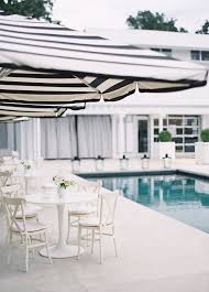 Black And White Striped Umbrella Poolside Black And White Striped Umbrellas Photography By Jose Villa Photography Outdoor Patio Umbrellas Patio Umbrellas Modern Patio
