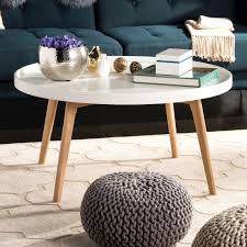 What kind of baskets can you put on a coffee table? Safavieh Sage Tray Top Round Coffee Table Coffee Table Round Coffee Table Scandinavian Coffee Table