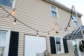 Use a staple gun loaded with 1⁄4 in (0.64 cm) staples to secure the cord to your patio cover. How We Hung Our Deck String Lights Privacy Screen And Artwork Outside Nesting With Grace