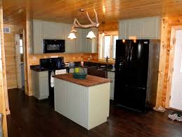 rustic kitchen with black appliances