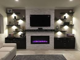 Four Truthful Tips How To Adorn Floating Cabinets The Wall Floating Cabinets Above Bed House Trendy Living Rooms Living Room With Fireplace Living Room Tv Wall