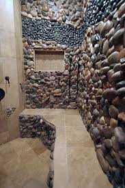 Landscape steel edging separates between rock garden and bark mulch. I Am Definitely Wanting To Do Something Like This On The Walls When I Re Do The Bathroom Bathroom Shower Tile River Rock Bathroom Rustic Shower