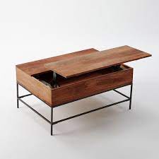 The marble top, solid wood legs and brass brackets weather well the more you use it. Industrial Storage Pop Up Coffee Table