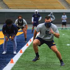 A superfan is ready for the game, if they'll only let her in. How A Power 5 Conference University Is Struggling To Have Sports In A Pandemic The New York Times