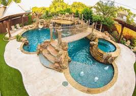 Although small, the pool includes a tanning ledge, a fountain, and decking that separates it from the lawn, while allowing easy entry and exit for swimmers. 55 Pool Landscaping Ideas Tropical Small Backyards Tropical Backyard Dream Pools Backyard Pool