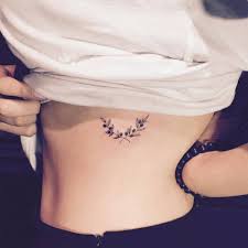 Most tattoo expert's advice against getting the first tattoo on the rib cage area. Small Olive Wreath Tattoo On The Left Side Ribcage