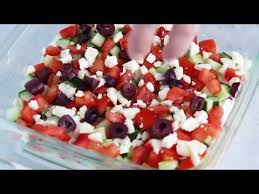 This Greek 7 Layer Dip Is Layered With Hummus Yogurt Cucumbers Tomatoes Feta And Olives Grab A Chip And Ser Skinny Taste Recipes Appetizer Recipes Recipes