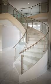 Modern Curved Staircase With Stainless Steel And Glass Railings For Clean Clear Views Project Staircase Railing Design Modern Staircase Stairs Design Modern