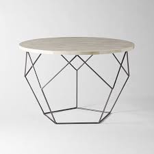 Placed next to the sofa or in front of armchairs, it displays books,. Origami Coffee Table