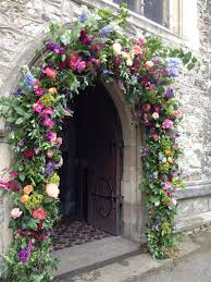 Colourful Floral Arch For The Ceremony Not Necessarily This Large Church Wedding Flowers Church Flowers Wedding Ceremony Flowers
