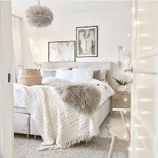 Clean White Bedroom With Neutral Accents Using Lots Of Texture Such As Rugs Faux Fur Blankets Woven Basket Feminine Bedroom Bedroom Decor Home Decor Bedroom