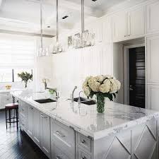 kitchen with wood floors and white cabinets