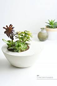 17 Gorgeous Planters To Help Your Garden Glow Diy Concrete Planters Minimalist Diy Projects Concrete Diy