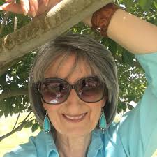 Is there any significance to Kat introducing herself as Rose in the grief  support group?