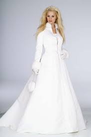Bridal Gowns For Winter Weddings Are A Timely Topic Even In The Heat Of Summer As Brides B Winter Wedding Gowns Christmas Wedding Dresses Winter Wedding Coat