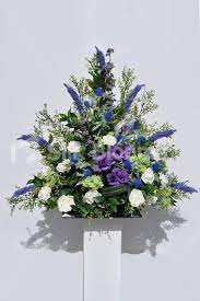 Scottish Inspired Ivory Rose Blue Thistle Purple Lisianthus And Veronica Floral C Church Flower Arrangements Purple Flower Arrangements Wedding Flowers Roses