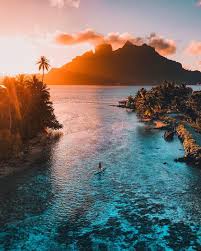 Nature, landscape, beach, sea, palm trees, clouds, island. Romance Bora Bora Rises From The Velvet Blues Of The Deep Water Up Through The Softer Hues Of T In 2020 Travel Photography Places To Travel Adventure Travel