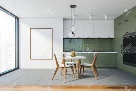 There are tons of options for gray cabinet colors. Interior Of Stylish Kitchen With White And Green Walls Tiled Stock Photo Picture And Royalty Free Image Image 156539445