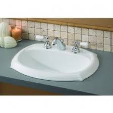 The sink hangs from its rim on top of the counter, while the bowl of the sink drops in to the counter, going below its surface. Cheviot 1375 Wh 4 Sheffield Drop In Basin With 4 Drop In Bathroom Sinks Ceramic Bathroom Sink Porcelain Bathroom Sink