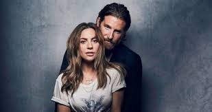 lady gaga and bradley cooper hold at number 1 on the