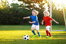 Kids Play Football Child At Soccer Field Kids Play Football On Outdoor Field Aff Field Soccer Children Outdo Kids Playing Soccer Playing Football