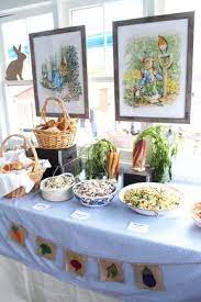 Peter Rabbit Inspired First Birthday Table Decorations The Well Dressed Table Rabbit Themed Baby Shower Rabbit Baby Shower Baby Shower Decorations For Boys