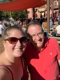 Dad getting into onesie to entertain his girls