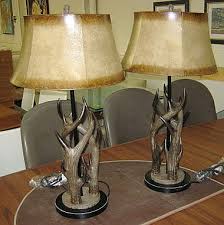 The rectangle semi drum shade is a sueded chocolate fabric. Sold Price Table Lamps A Pair Stag Horn Design In Resin Invalid Date Gmt