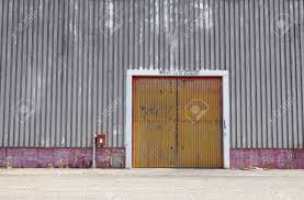 From front entry doors, patio doors, pantry doors, exterior doors, wood doors, fiberglass doors, iron doors, and barn doors, you'll find what you need right here. The Sheet Metal Factory Wall With The Entrance Door In The Industrial Park The Red Door Of The Factory Building Stock Photo Picture And Royalty Free Image Image 86126668