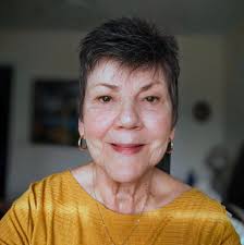 How can I style my hair to make my chin less noticeable?