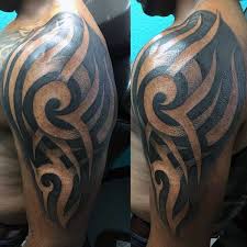 Visually stunning bold geometric tribal tattoo on arm for guys. 75 Tribal Arm Tattoos For Men Interwoven Line Design Ideas