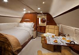Airplane for private flights low angle view of luxury airplane for private flights stationary on airport runway against blue sky. Bedroom Luxury Private Jet Interior Luxury Bedrooms Ideas