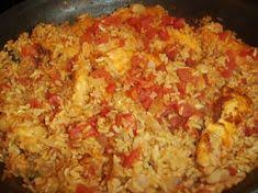 Add 5 cups of water, the chopped veggies, chicken breast . Arroz Con Pollo