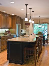 A large kitchen featuring a huge center island with space for a breakfast bar and features a granite countertop. Modern And Traditional Kitchen Island Ideas You Should See