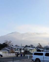 The Wasatch Mountains nearly hidden in from the inversion in Ogden.