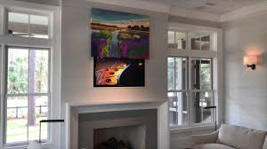 Incorporating your tv into a wall covered with black boxes will make it have less of a sore thumb effect visually. Hide Your Tv With Art The Media Decor Eclipse Vertical Art Lift Youtube