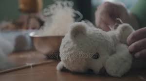 Planning comes first when you make a stuffed toy. The Process Of Stuffing A Soft Toy Filler Handmade Teddy Bear Video By C Serushkov Stock Footage 153019092