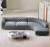 Sofá seccional gris Chesterfield curvo en forma de L de terciopelo tapizado