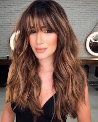 The look is the best style by sweeping the hair to one side. 50 Prettiest Long Layered Haircuts With Bangs For 2021 Hair Adviser