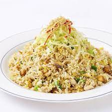 Rice served with omelette strips, cucumber and coriander, doused with fish sauce, . Salted Fish Fried Rice Madam Kwan S