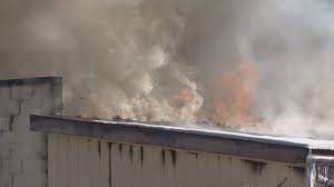 Crews are working to put out a...