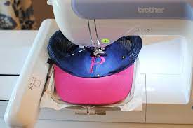 How To Machine Embroidery On Hats Machine Embroidery Tutorials Machine Embroidery Hat Embroidery Machine
