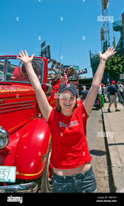 Woman Red Sox Fan At Famous Historic Fenway Park In Boston Mass In Front Old Red Sox Fire Truck In Baseball Mode Stock Photo Alamy