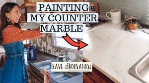 And you can take it up another notch by adding a decorative faux marble finish. Painting Our Counter Marble Faux Marble Countertops On A Budget Youtube
