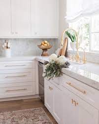 The wooden worktops and table add texture and warmth. Adorable Ideas Of Using Gold In The Kitchens