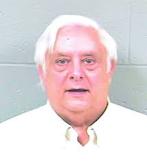 Wooley sentenced to at least 34 months in prison and ordered to pay back  embezzled $317,129
